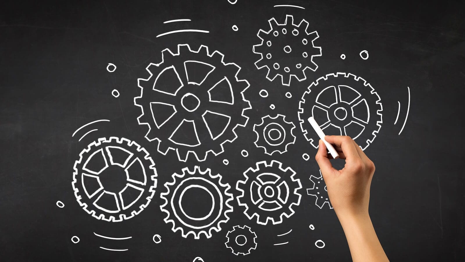 Gears on chalkboard of different sizes